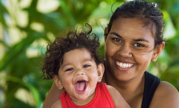 Aboriginal mother and child smiling