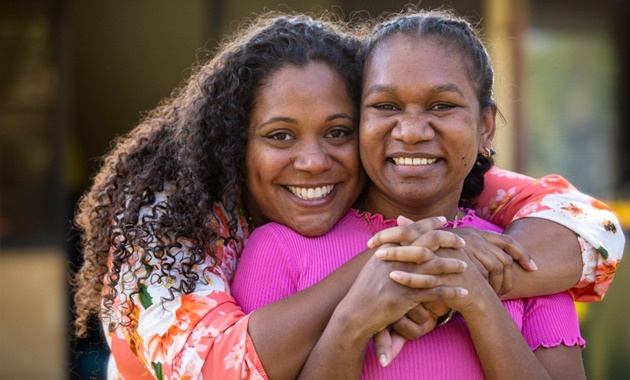 Two women from Kulbardi Aboriginal Centre hugging