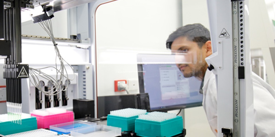 researcher looking at results in lab