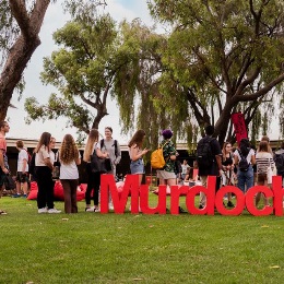 Students behind the Murdoch sign