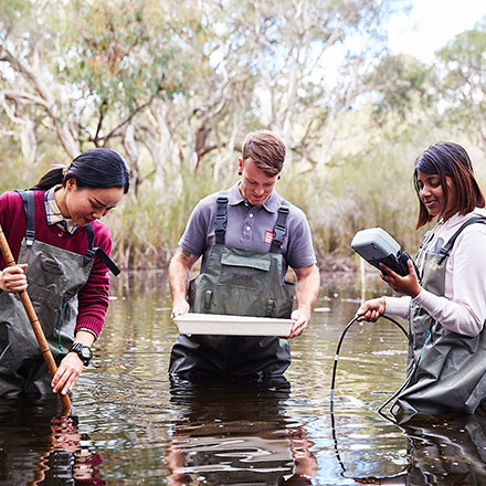 Students doing tests in a lake