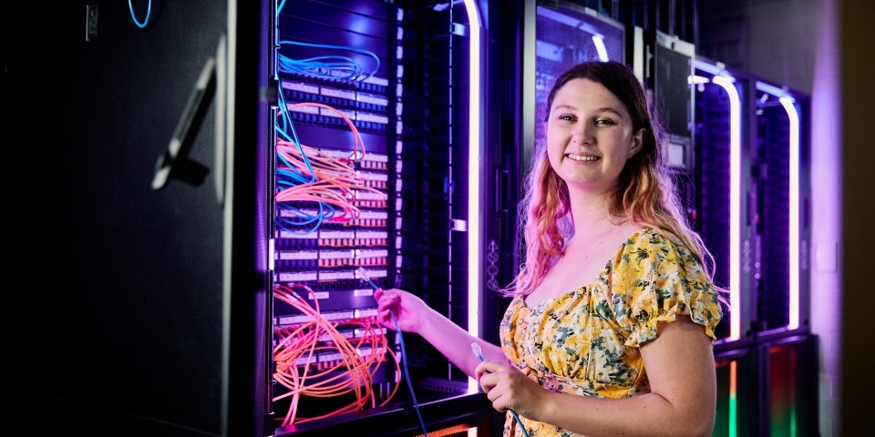 Girl standing in front of IT data lab