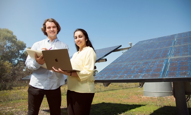 Renewable Energy Engineering students working with solar panels
