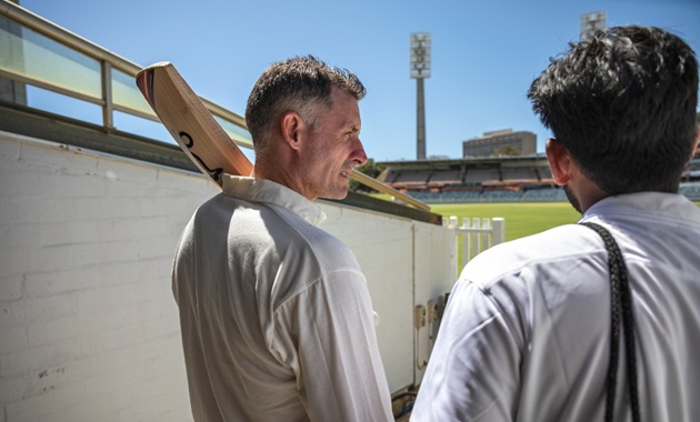 WA Cricketer Mike Hussey with a Murdoch student at the WACA Ground.