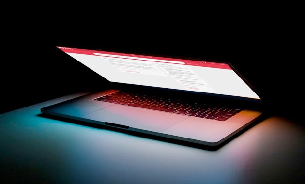 laptop in dark background