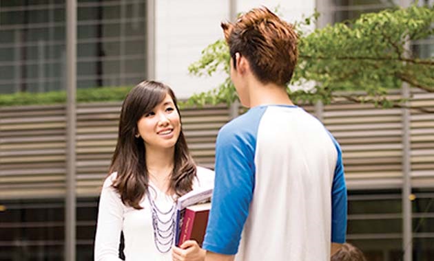 Two Singaporean students talking to each other