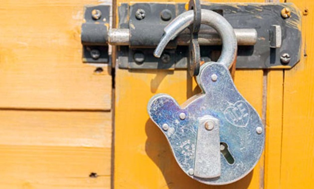 Unlocked padlock on door