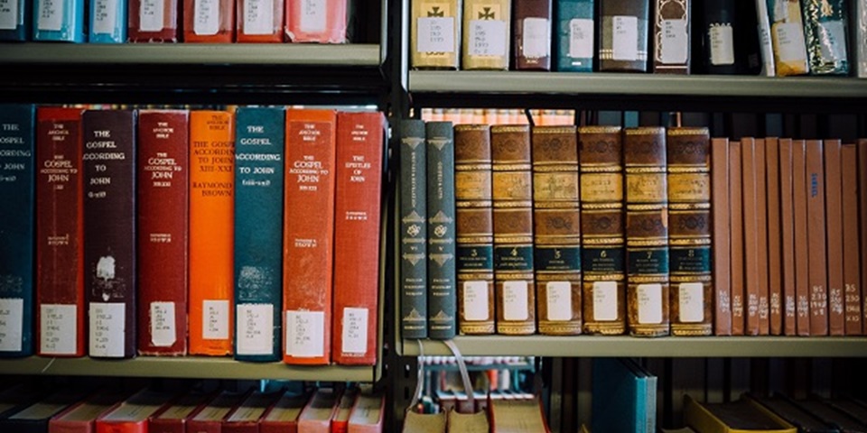 A selection of Theology books on Library shelves