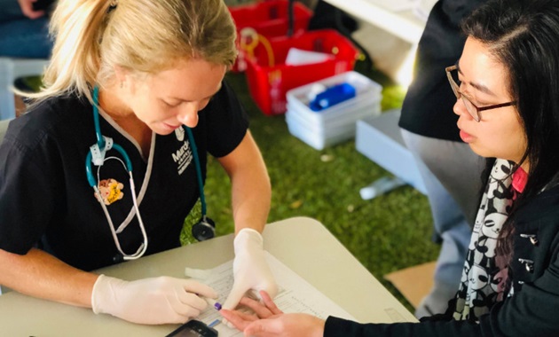 A nursing student performs a test