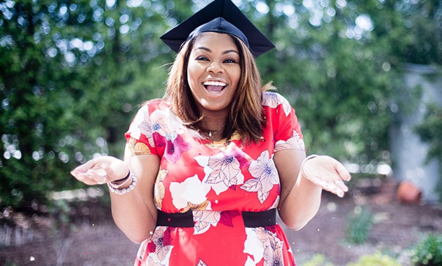 Mature age woman wearing graduation hat