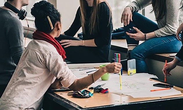 Group of people studying at a table