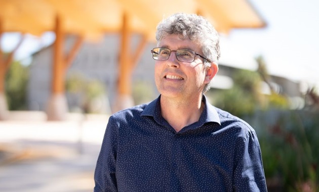 Murdoch University's Jonathan Whale smiling off camera outside of Boola Katitjin