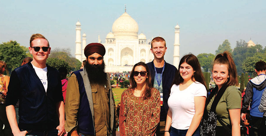 Law students posing in front of the Taj Mahal
